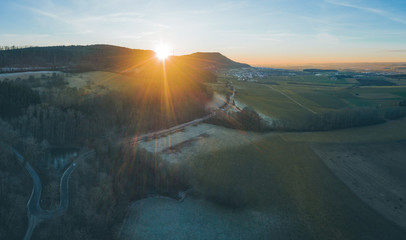 Aerial, panoramic view of a country road in a rural area at sunset, Essingen, Germany