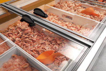 Different fresh raw shrimps on display. Wholesale market