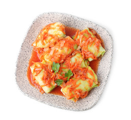 Delicious cabbage rolls with sauce isolated on white, top view