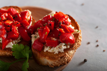 Fast and tasty Italian appetizer. Crispy, toasted bread with cheese, sweet pepper, garlic and herbs.