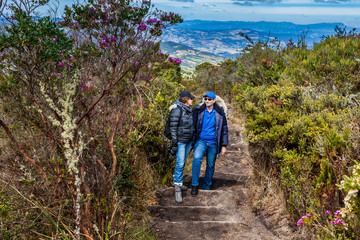 Young couple exploring nature at a beautiful paramo at the department of Cundinamarca in Colombia