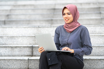 Businesswoman sit at office staircase.