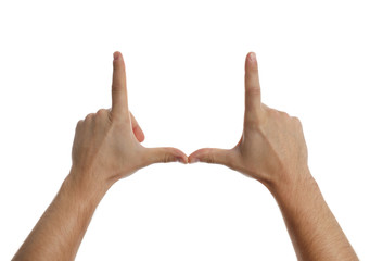 Man making frame with his hands on white background, closeup