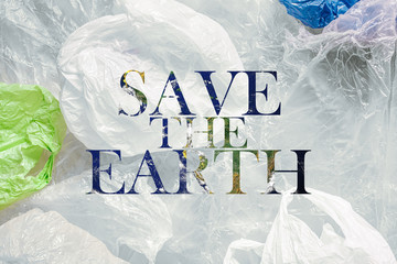 save planet, earth buried in pvc, inscription save the earth