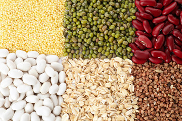 Different grains and cereals as background, top view