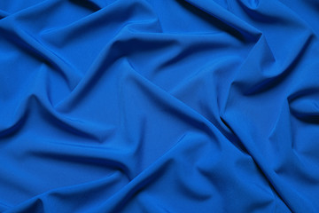 Crumpled fabric, top view. Color of the year 2020 (Classic blue)