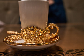 cup of coffee with golden decoration