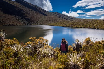 Fototapeten Young woman exploring the nature of a beautiful paramo at the department of Cundinamarca in Colombia © anamejia18
