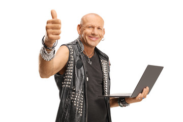 Punker with a laptop computer showing a thumb up