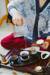Tea master pours Chinese tea.