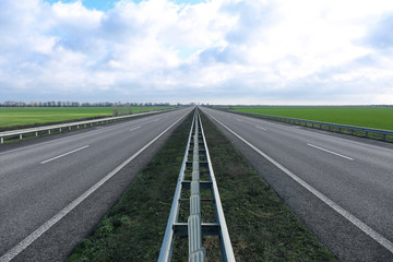 Beautiful view of asphalt highway without transport