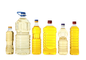 Cooking oil in different bottles isolated on white