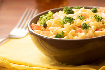 Creamy veggie macarroni salad. Pasta with tomatoes and broccoli. Delicious vegan dish