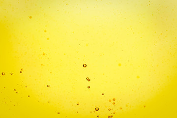 Cooking oil with bubbles as background, closeup