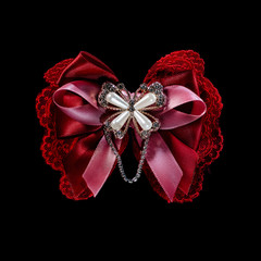 Red decorated ribbon isolated on black background