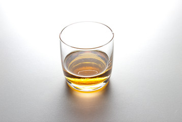 glass of whiskey on white background.