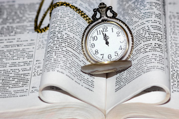 pocket watch with book background