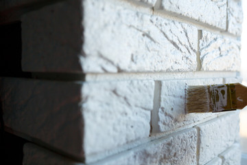 painting plaster decorative brick with white paint