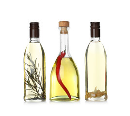 Different sorts of cooking oil in bottles isolated on white