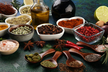 Spices and herbs on table. Food and cuisine ingredients with oil and vinegar