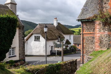 Fototapeta na wymiar Path from churchyard to main street in the center of the pretty Devon village of Dunsford