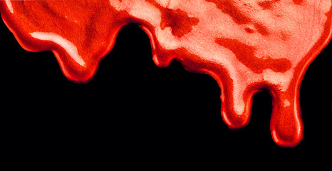 Dripping liquid red paint texture, isolated on black background. Flowing metallic paint drops close-up. Leaking Lipgloss,  lipstick. Blots of nail polish, border art design