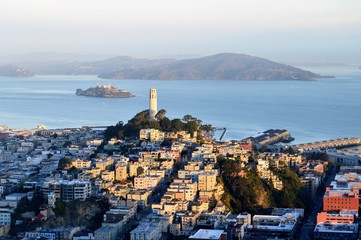 View toward the Coit Tower on Telegraph Hill with Alcatraz Island and the San Francisco Bay in the...