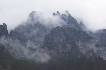Dark mountains in the fog and clouds