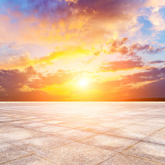 Naklejka premium Tiled pavement plazas terrace skyline and sunset sky clouds.