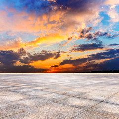 Fototapeta na wymiar Tiled pavement plazas terrace skyline and sunset sky clouds.