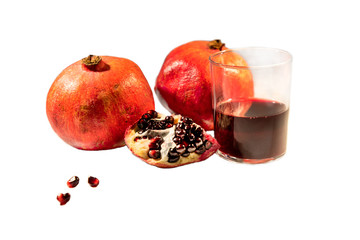 pomegranate and juice in a glass on white background 