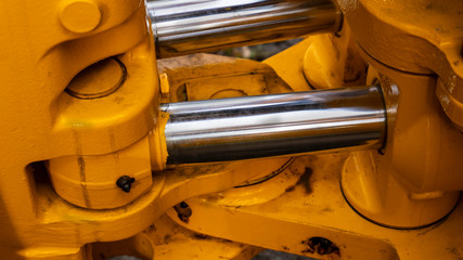 twin hydraulic cylinder detail on a new construction tractor