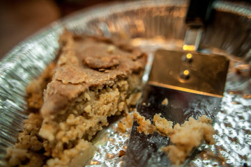Close up top view of delicious baked vegetarian healthy meat pie made with millet in an aluminum tray. Home made vegan food meal.