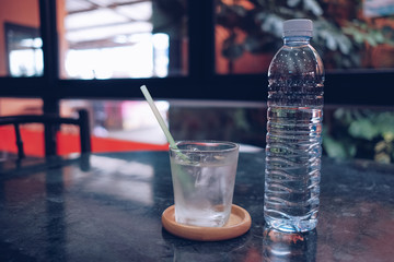 A glass of water placed on the table. Glass of water on luxury table setting for dining.