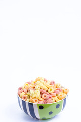 Cereal flakes in bowl on isolated white background with copy space