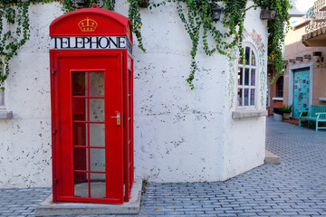 Obraz premium Beautiful telephone booth. Red telephone box