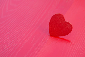 Wooden heart on a red wooden table Show love Valentine Festival, Concept of Love