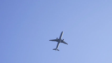 Fototapeta na wymiar plane in clear blue sky. flying passenger plane in clear blue. air transport traveling by plane