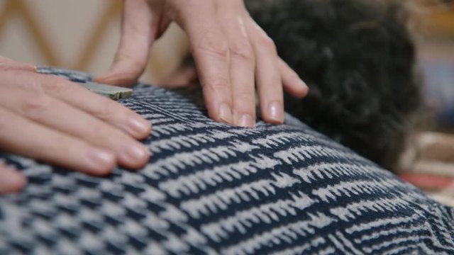 Healing hands during a Reiki crystal healing session