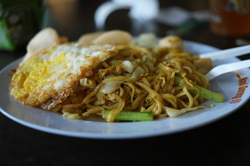 Spicy fried noodle served on plate