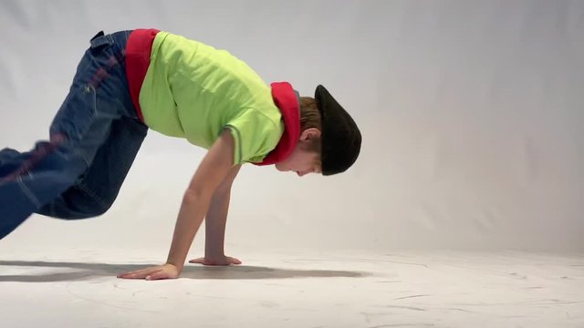 little boy dancing breakdance, dynamic leg work