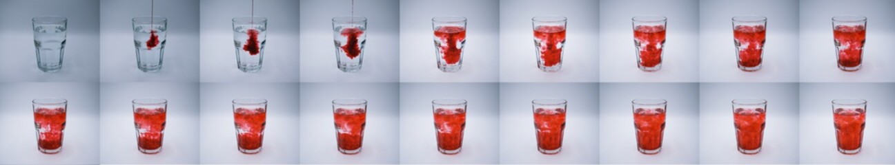 Stop motion image showing red dye poured into a glass of water