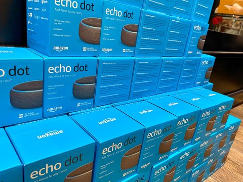 NEW YORK- DECEMBER 30, 2019: Shot is of Amazon Echo Dot. Smart speaker AMZN Jeff Bezos CEO. Has virtual assistant Alexa. Ask for music, news, information in your smart home.