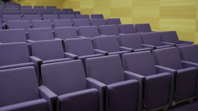 Seats in an empty theatre or auditorium - modern looking