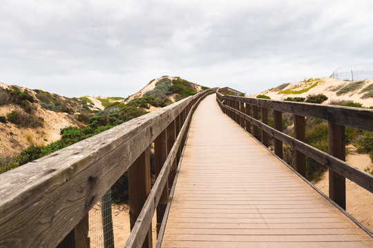 Rustic Wood Beach Boardwalk Through Sand Dunes. Oso Flaco Lake Natural Area State Park, California