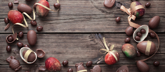 chocolate eggs on dark wooden background