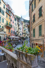 Fototapeta na wymiar Riomaggiore's main street of the coastal area Cinque Terre in the Italian province La Spezia