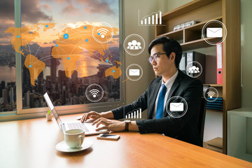 Global network technology and business connection concept with businessman and Hong Kong Central Business District background