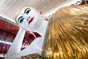 Beautiful Reclining Buddha Chauk htat gyi. Buddha Temple in Yangon, Myanmar,
