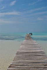 Skew wooden bridge at Cayo Largo also known as Cayo Rico at Cuba. Little islands in a dreamlike nature paradise. Caribbean Feeling.